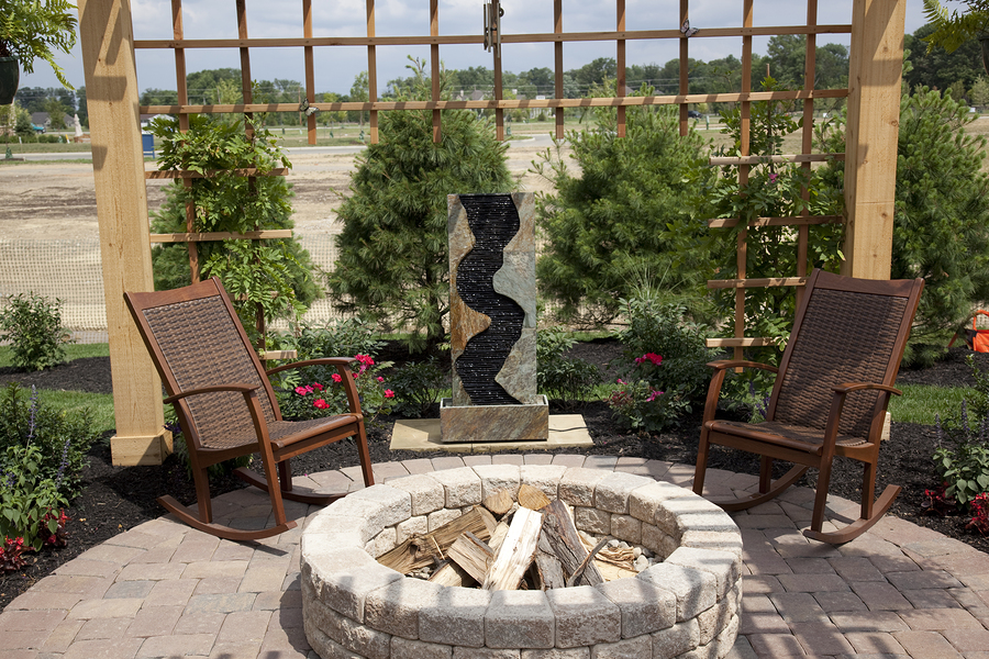 cozy bricked flor patio with a brick fir pit