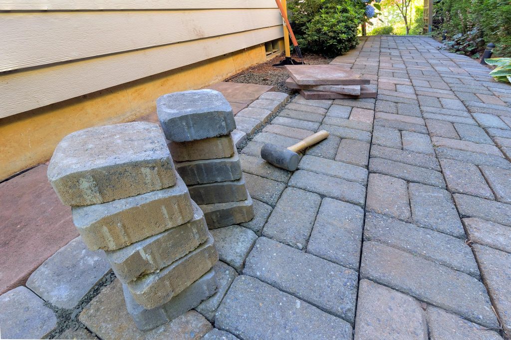 brick tiles on the floor and a hammer